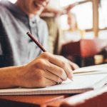 NIOS On-Demand Exams in Bangalore student preparing for examstudent writing exam and preparing for improvement