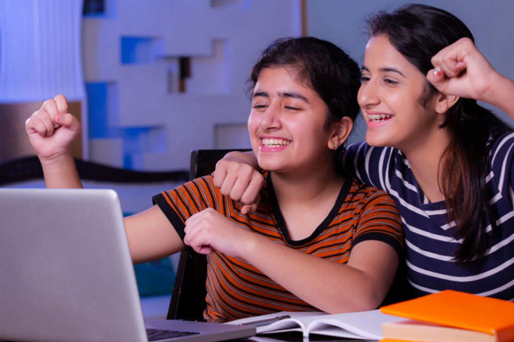 NIOS Schools in Karnataka students studying online with parent support
